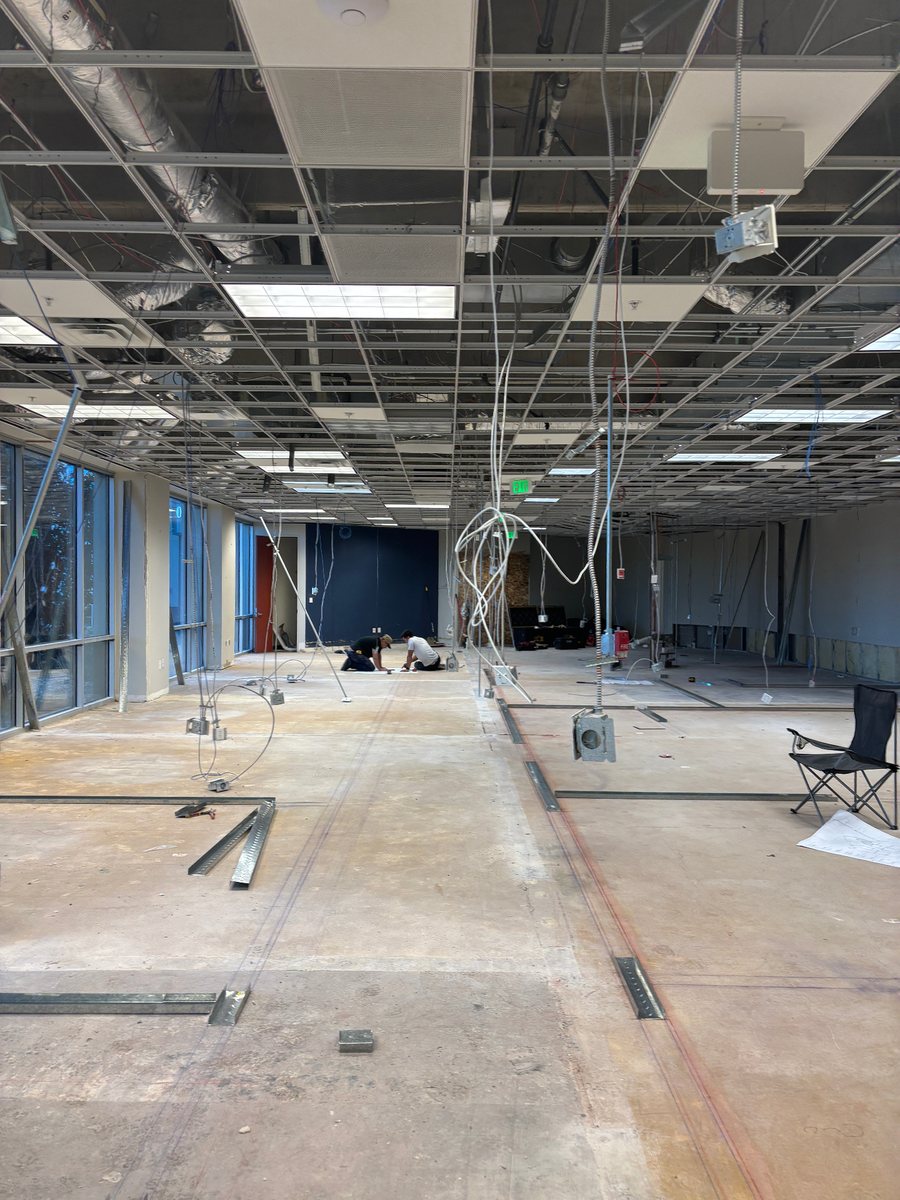 Floor tracks and layout lines marked on a concrete slab before studs go up